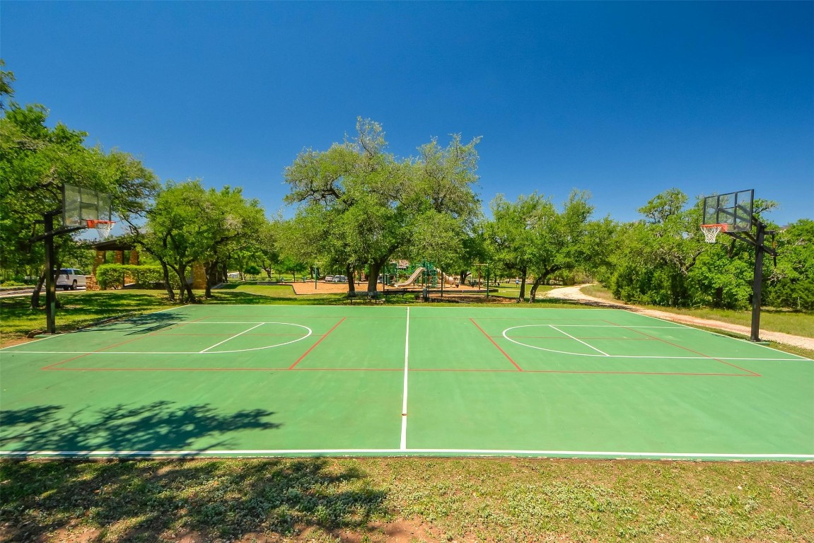 8040 Carlton Ridge Cove Austin, TX 78738 - Photo 37 of 40 a view of a playground with basketball court