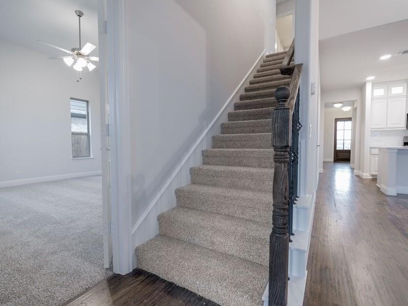 145 Winterwood Drive Lavon, TX 75166 - Photo 14 of 24 Staircase featuring wood-type flooring and ceiling fan