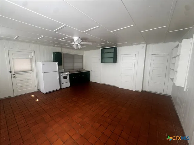 a view of a livingroom with a kitchen