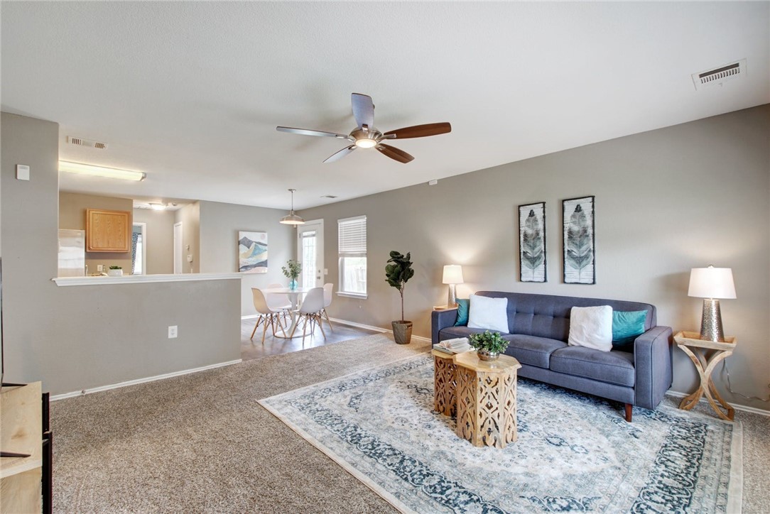 a living room with furniture and a table