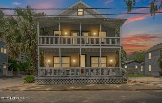 a view of a two chairs in the patio