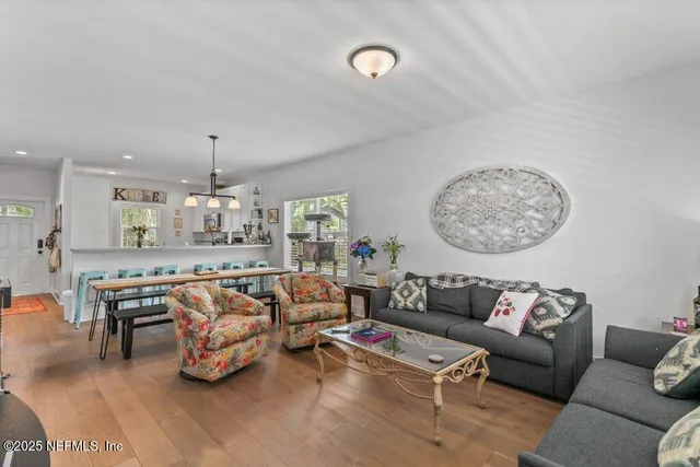 a bedroom with furniture and a flat screen tv