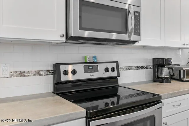 a view of entryway with wooden floor and stairs