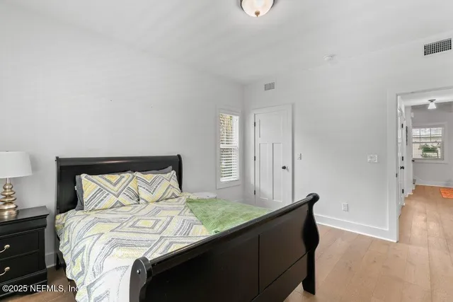 a porch with seating space and potted plants