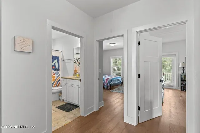 a bedroom with double bed and a couch