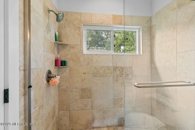 a bedroom with a bed and a book shelf