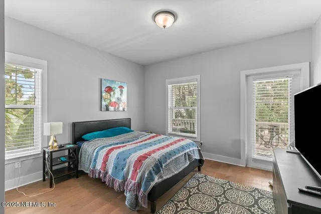 a bathroom with a sink mirror and toilet