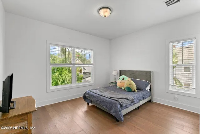 a view of balcony with wooden floor