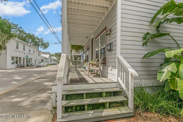 a view of a balcony with chairs