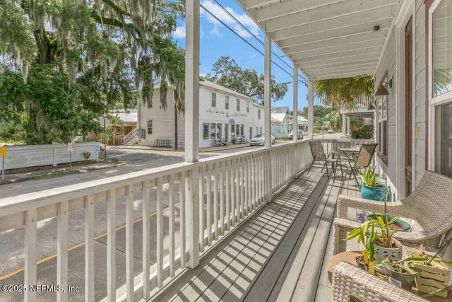 a view of front door with a chair