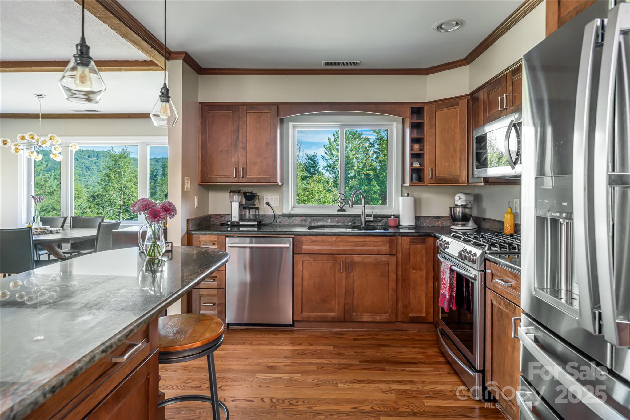 79 Horizon Hill Road Asheville, NC 28804 - Photo 21 of 48 a kitchen with stainless steel appliances granite countertop a stove a sink and a refrigerator