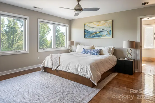 a spacious bedroom with a large bed and a window