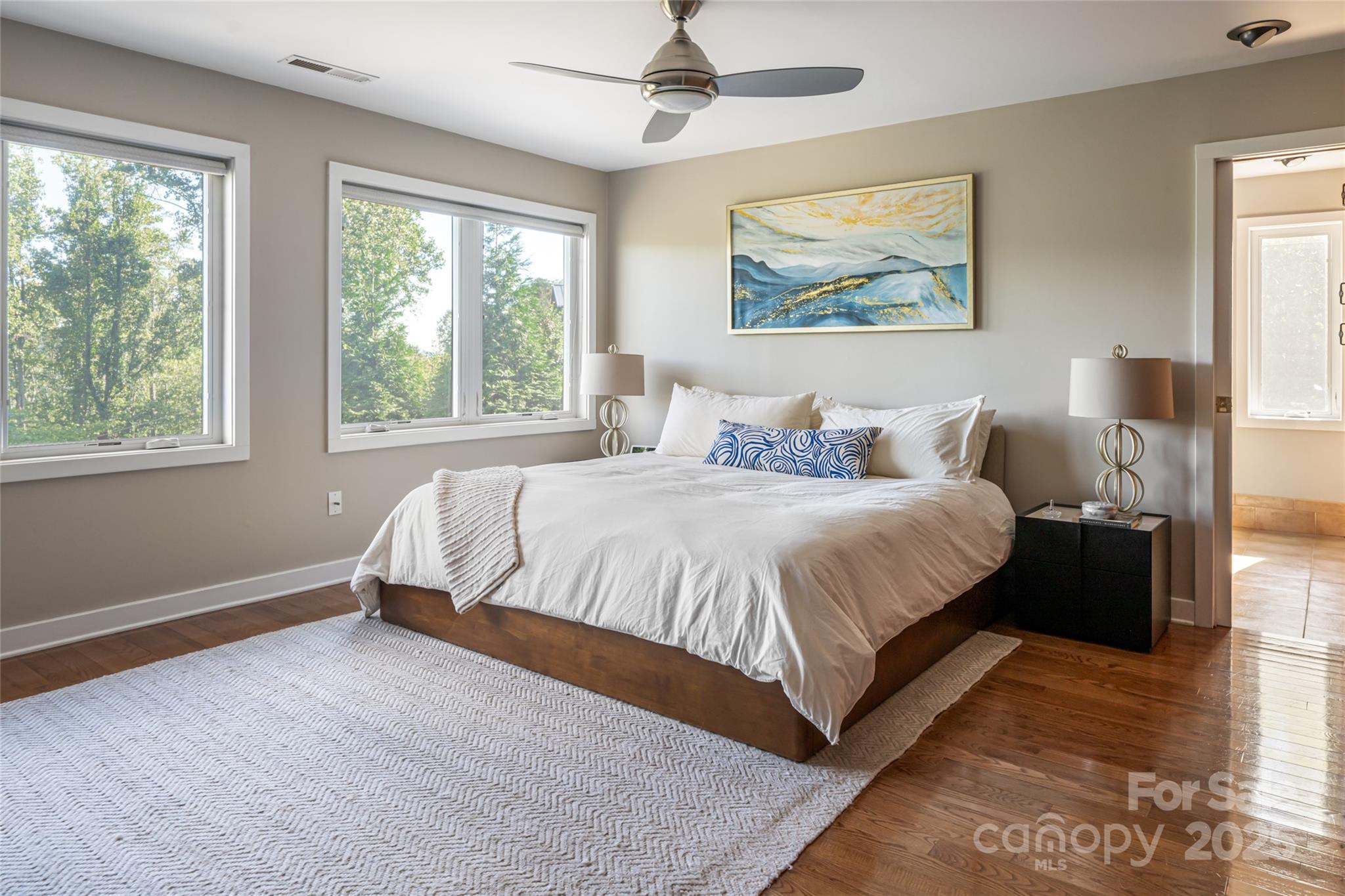 79 Horizon Hill Road Asheville, NC 28804 - Photo 23 of 48 a spacious bedroom with a large bed and a window