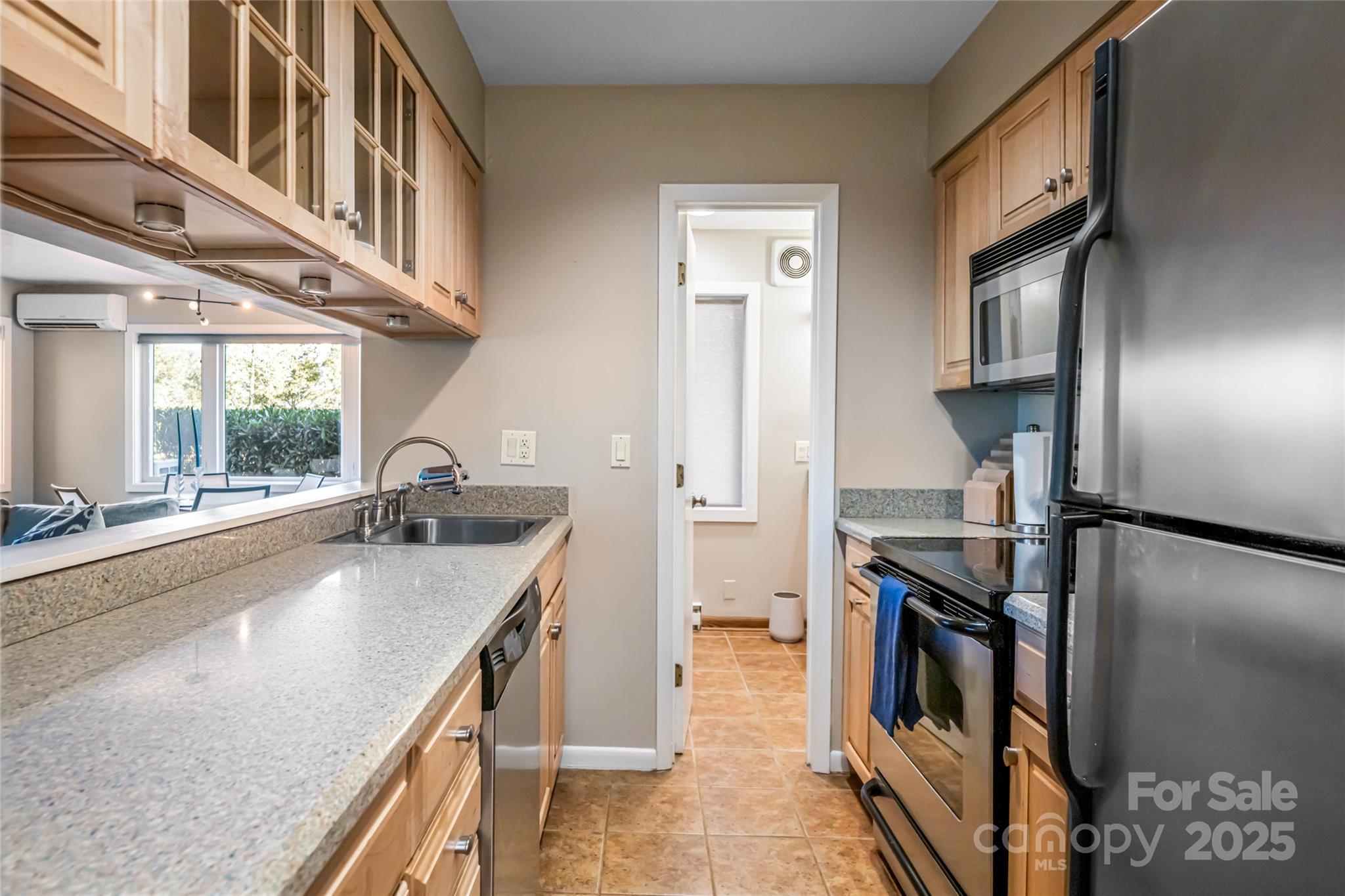 79 Horizon Hill Road Asheville, NC 28804 - Photo 30 of 48 a kitchen with stainless steel appliances granite countertop a sink a stove and a refrigerator