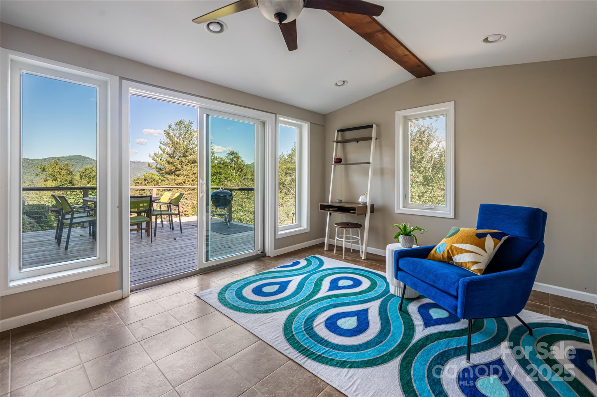 79 Horizon Hill Road Asheville, NC 28804 - Photo 35 of 48 a living room filled with furniture and a floor to ceiling window