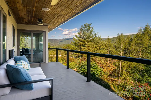 a view of balcony with furniture
