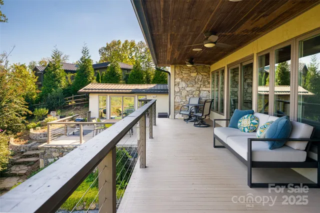 a view of a chairs and table on the deck with wooden floor
