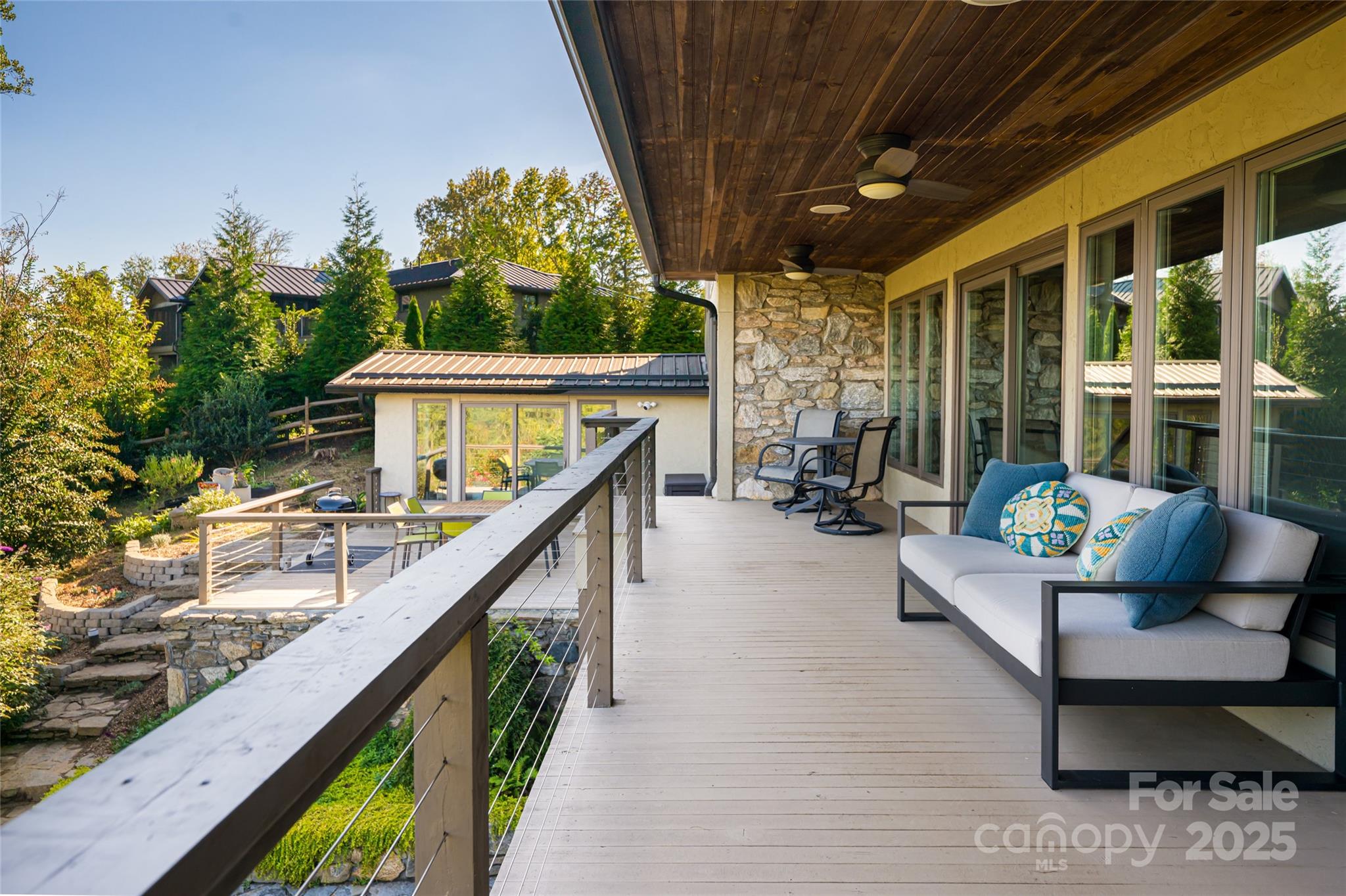 79 Horizon Hill Road Asheville, NC 28804 - Photo 39 of 48 a balcony with furniture and a potted plant