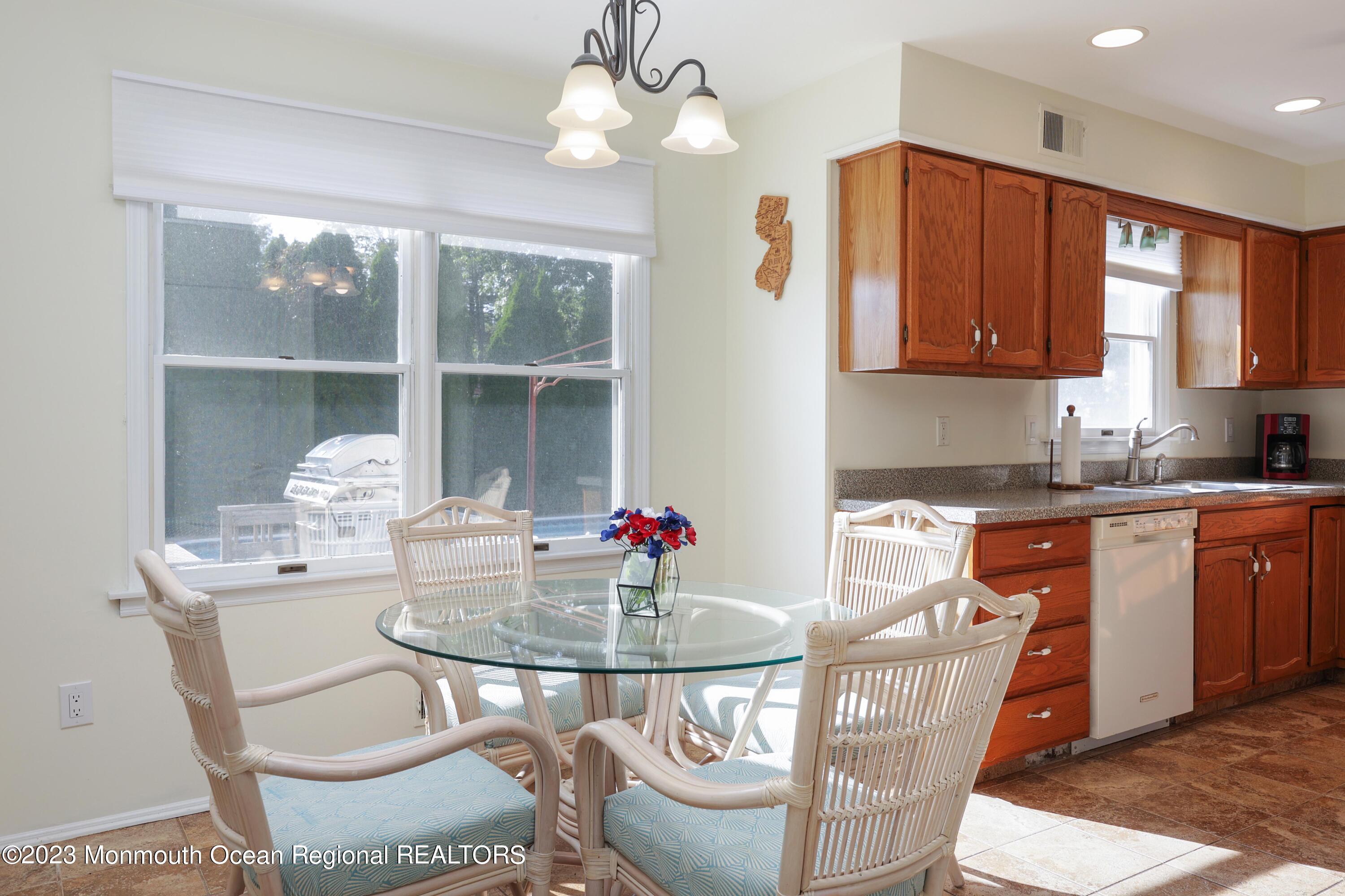 146 Jordan Road Brick, NJ 08724 - Photo 13 of 36 a view of a dining room with furniture wooden floor and chandelier