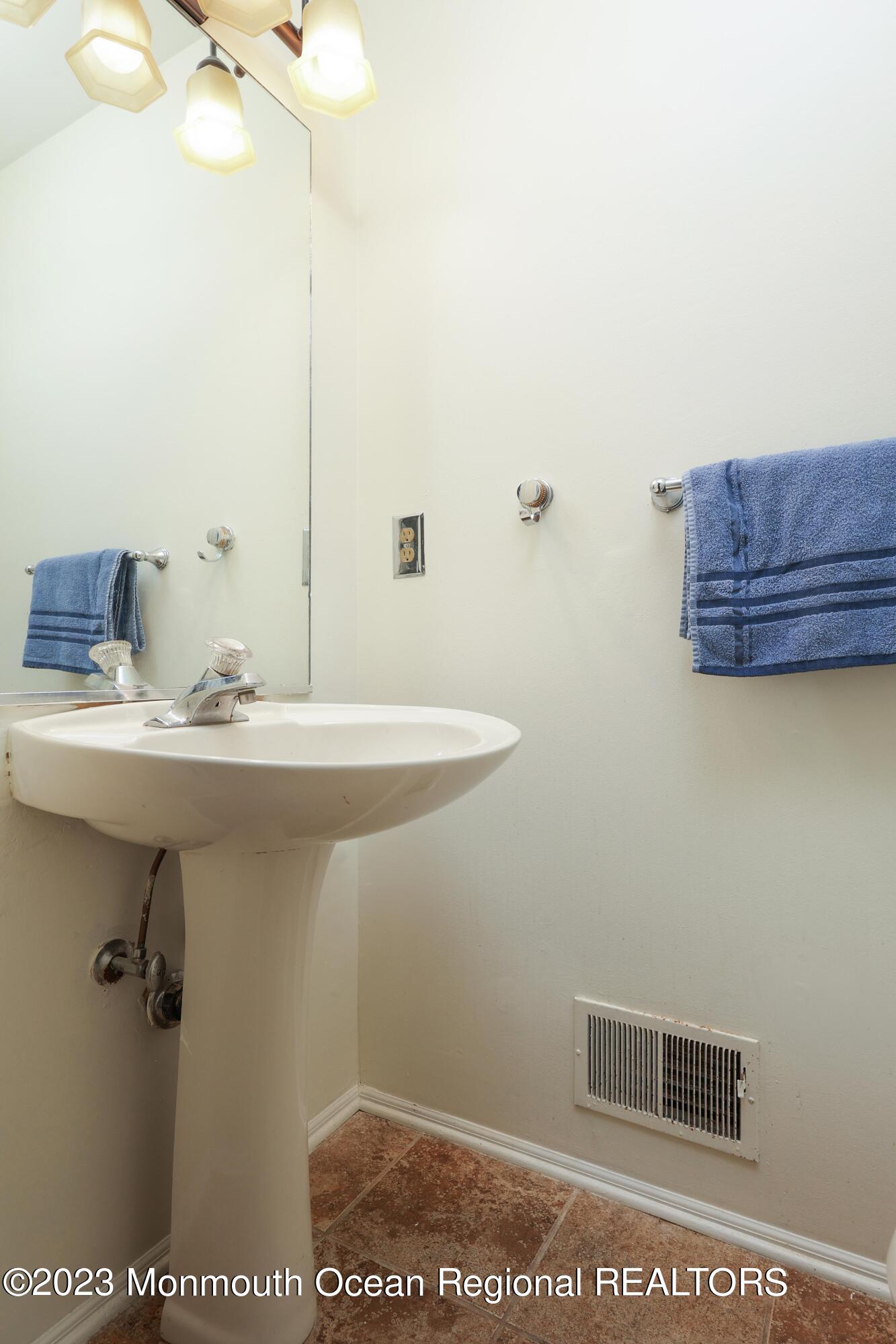 146 Jordan Road Brick, NJ 08724 - Photo 19 of 36 a bathroom with a sink a toilet and mirror