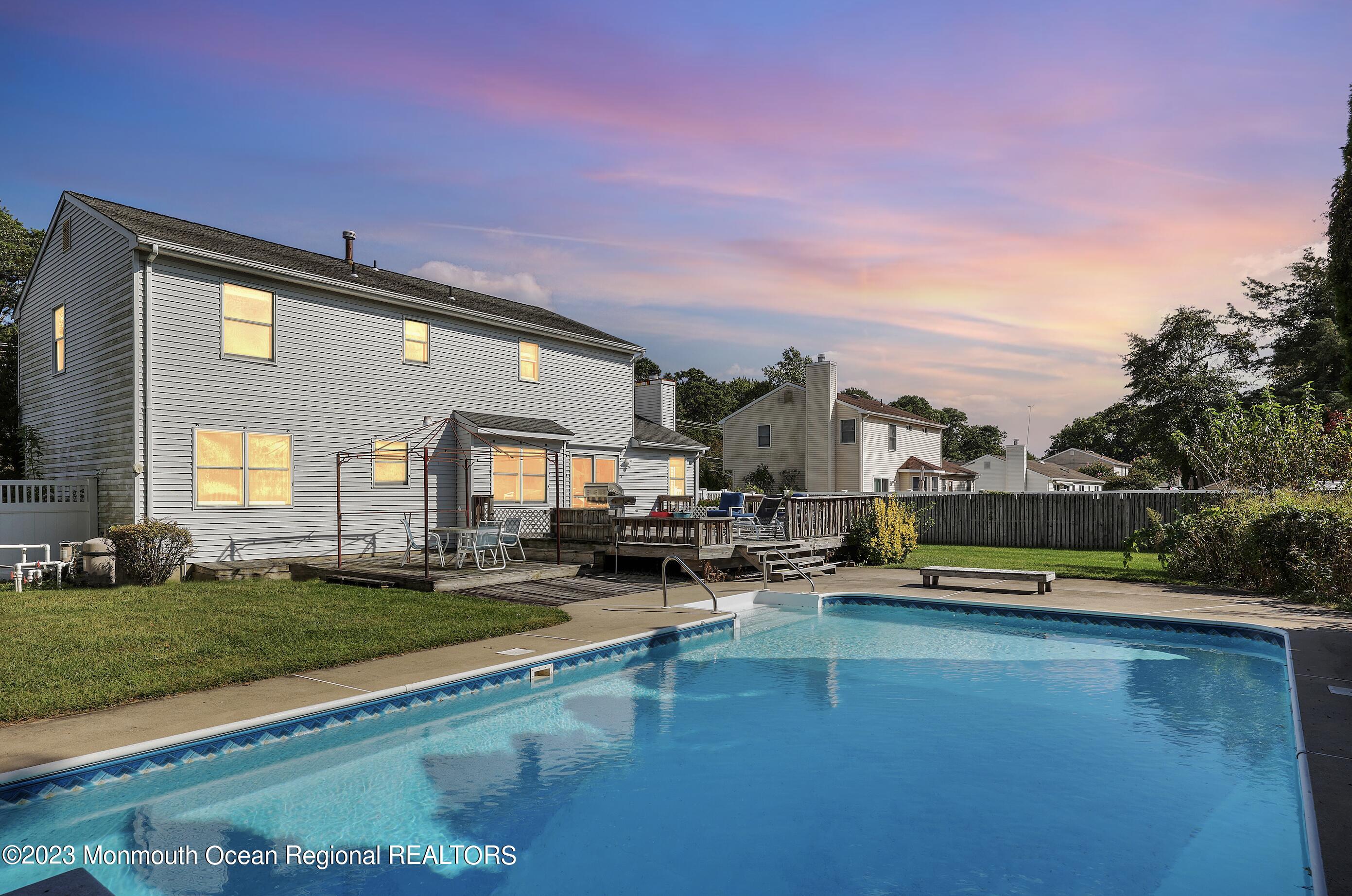 146 Jordan Road Brick, NJ 08724 - Photo 2 of 36 a view of a house with a swimming pool and a yard