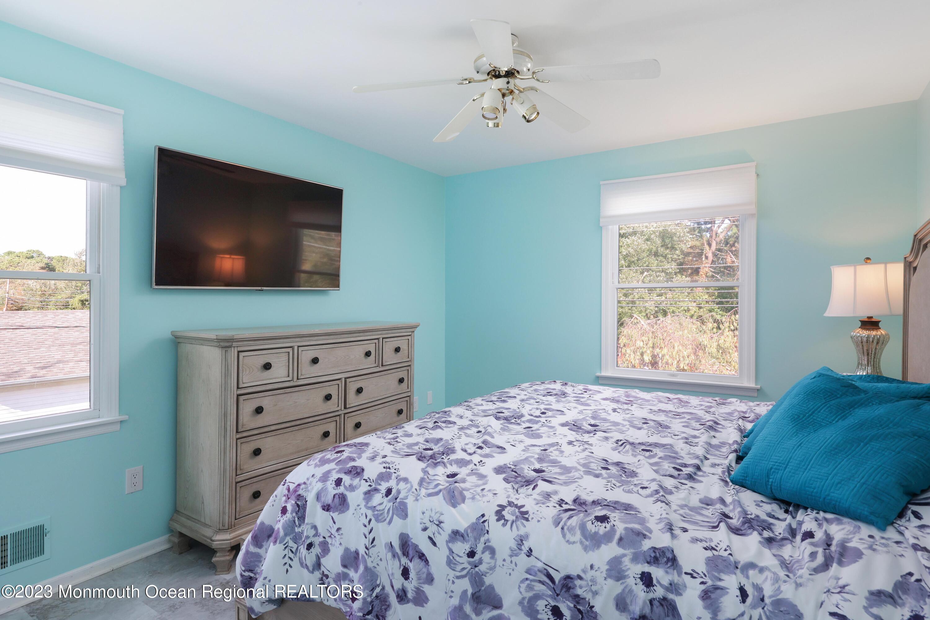 146 Jordan Road Brick, NJ 08724 - Photo 24 of 36 a bedroom with a bed and a flat screen tv