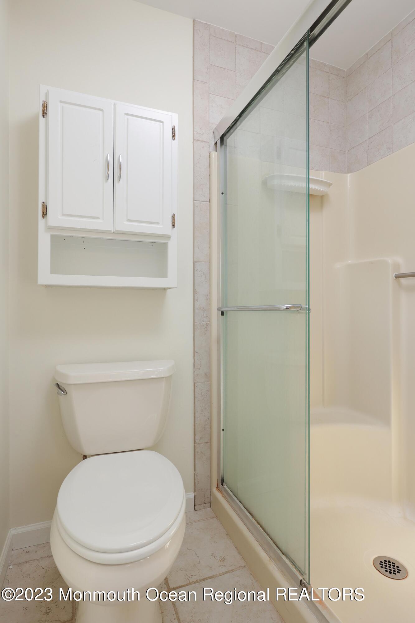 146 Jordan Road Brick, NJ 08724 - Photo 26 of 36 a bathroom with a toilet and a shower