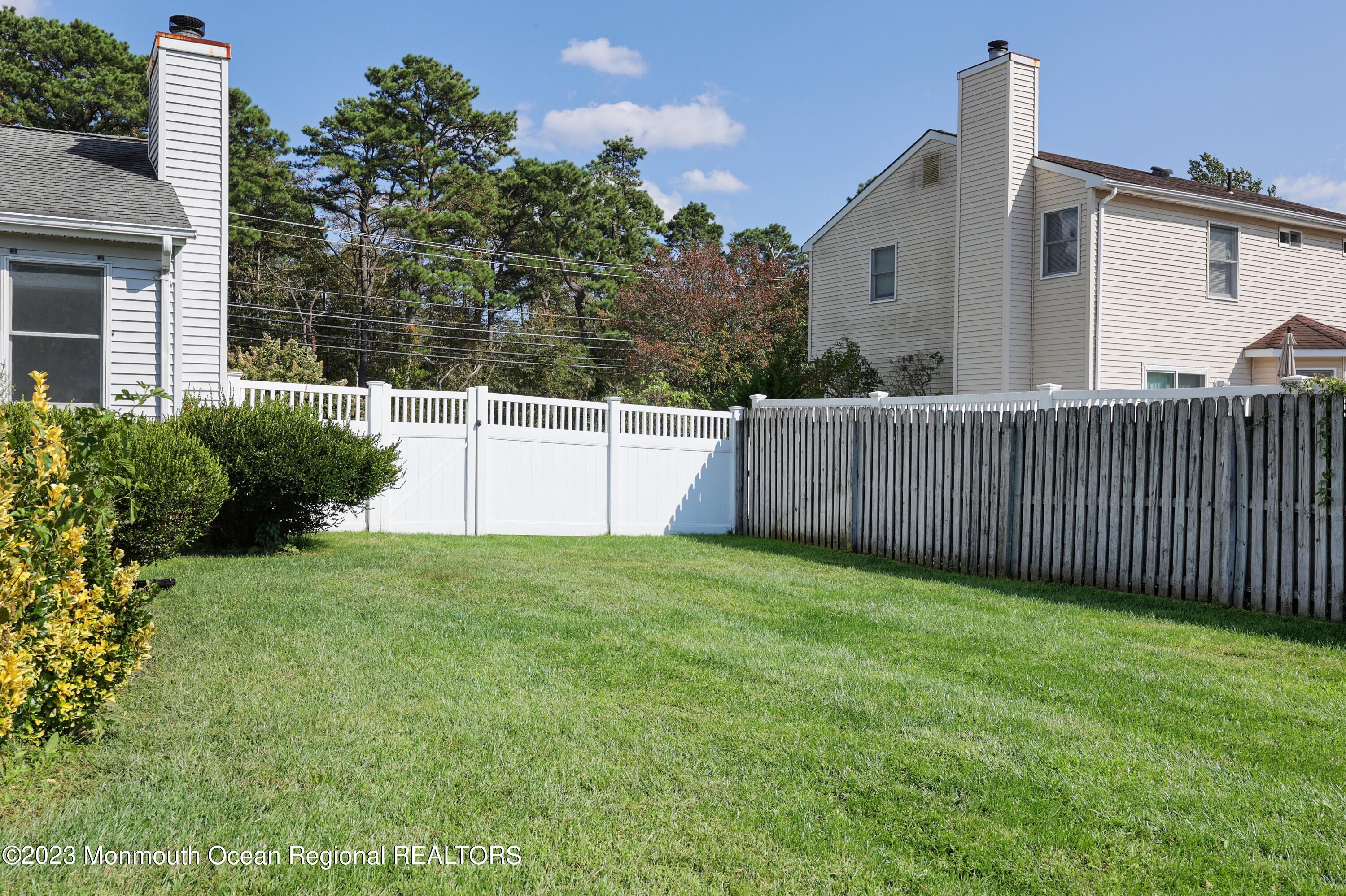 146 Jordan Road Brick, NJ 08724 - Photo 30 of 36 a view of a backyard with plants and large tree