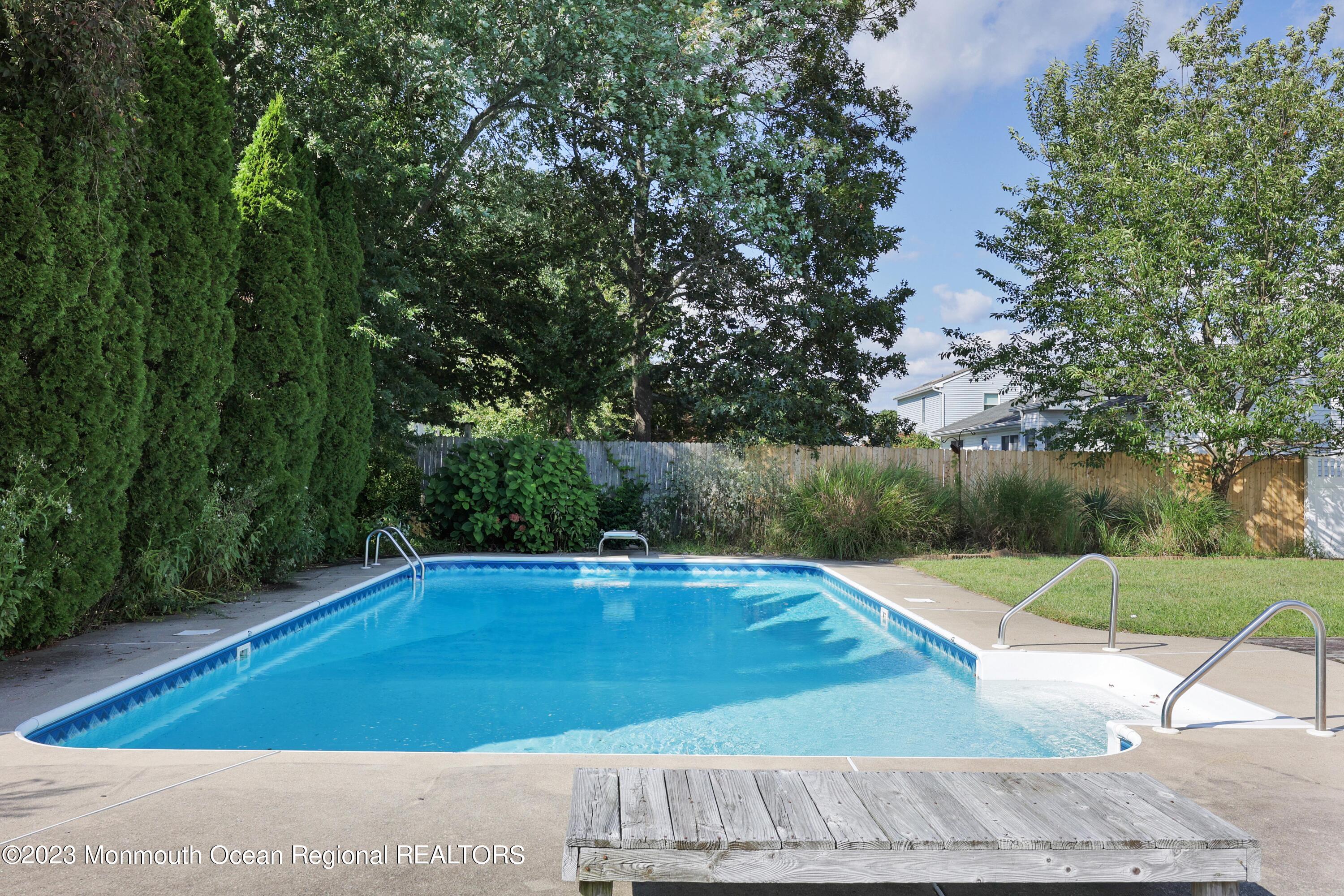 146 Jordan Road Brick, NJ 08724 - Photo 33 of 36 a view of a swimming pool with an outdoor space and seating area