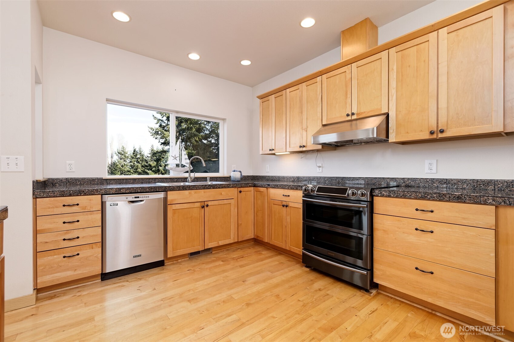 20 East Case View Place Shelton, WA 98584 - Photo 11 of 40 a kitchen with granite countertop white cabinets and white appliances