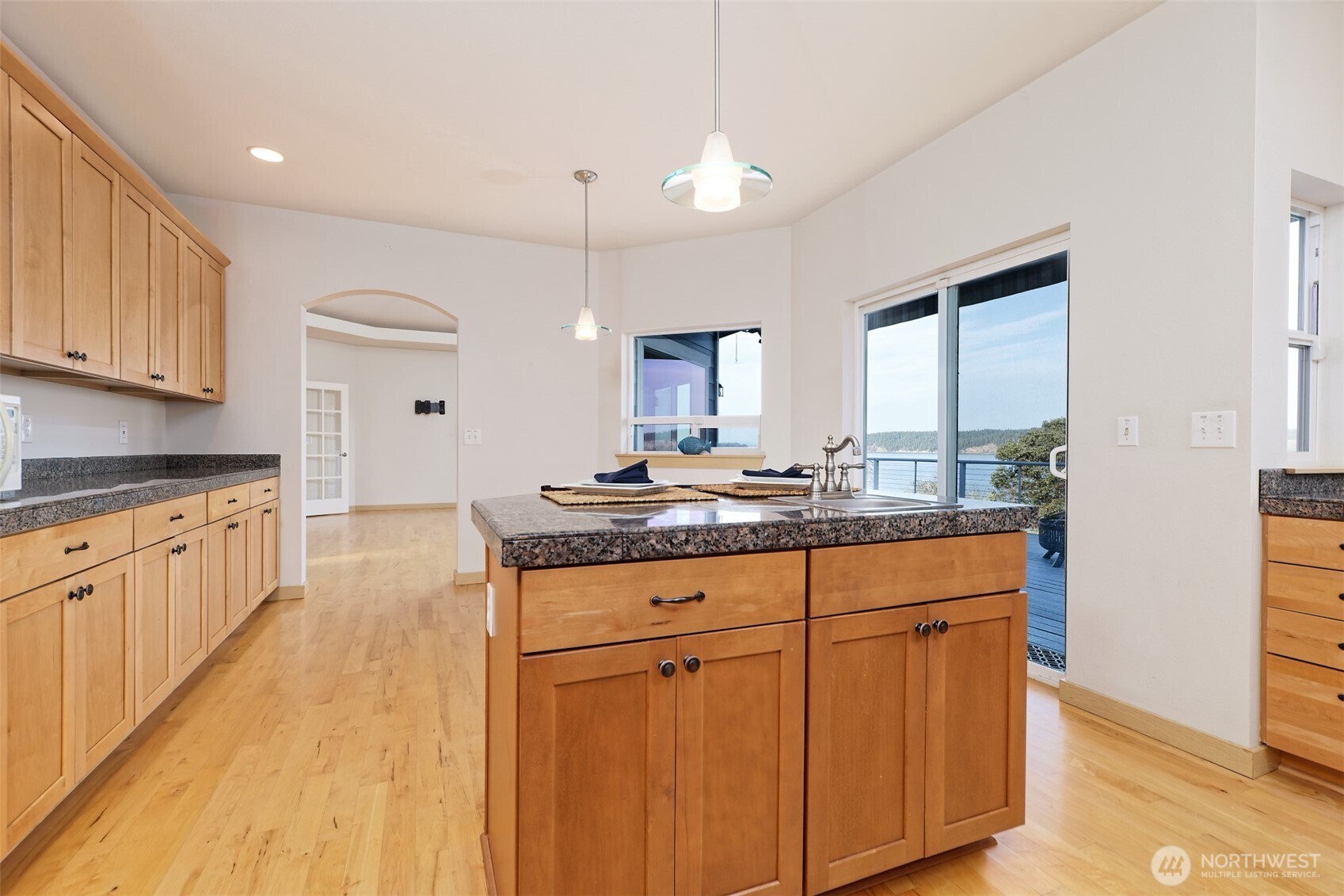 20 East Case View Place Shelton, WA 98584 - Photo 13 of 40 a large kitchen with granite countertop a sink and dishwasher a stove with wooden floor