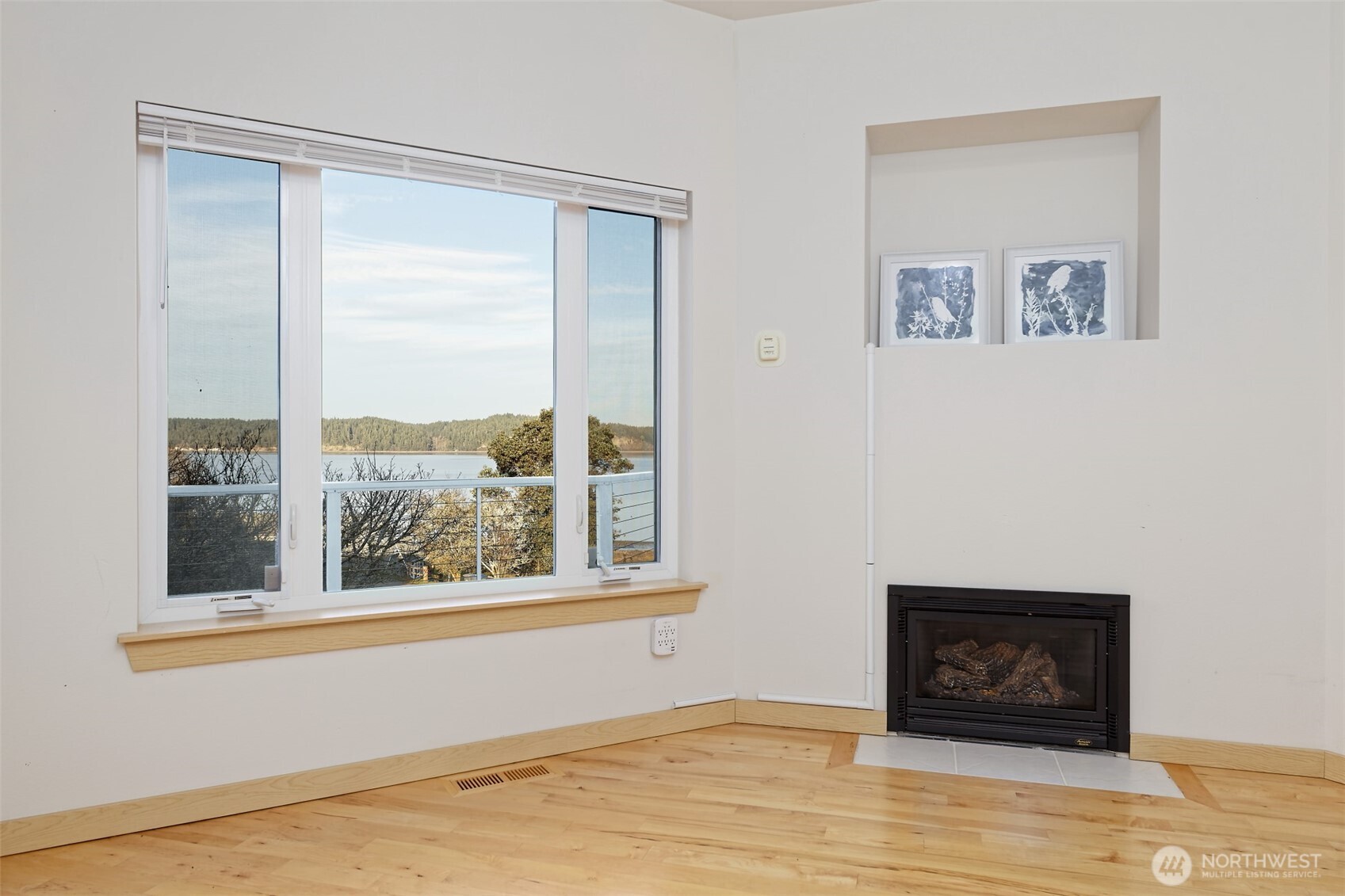 20 East Case View Place Shelton, WA 98584 - Photo 16 of 40 a view of an empty room with a window and wooden floor