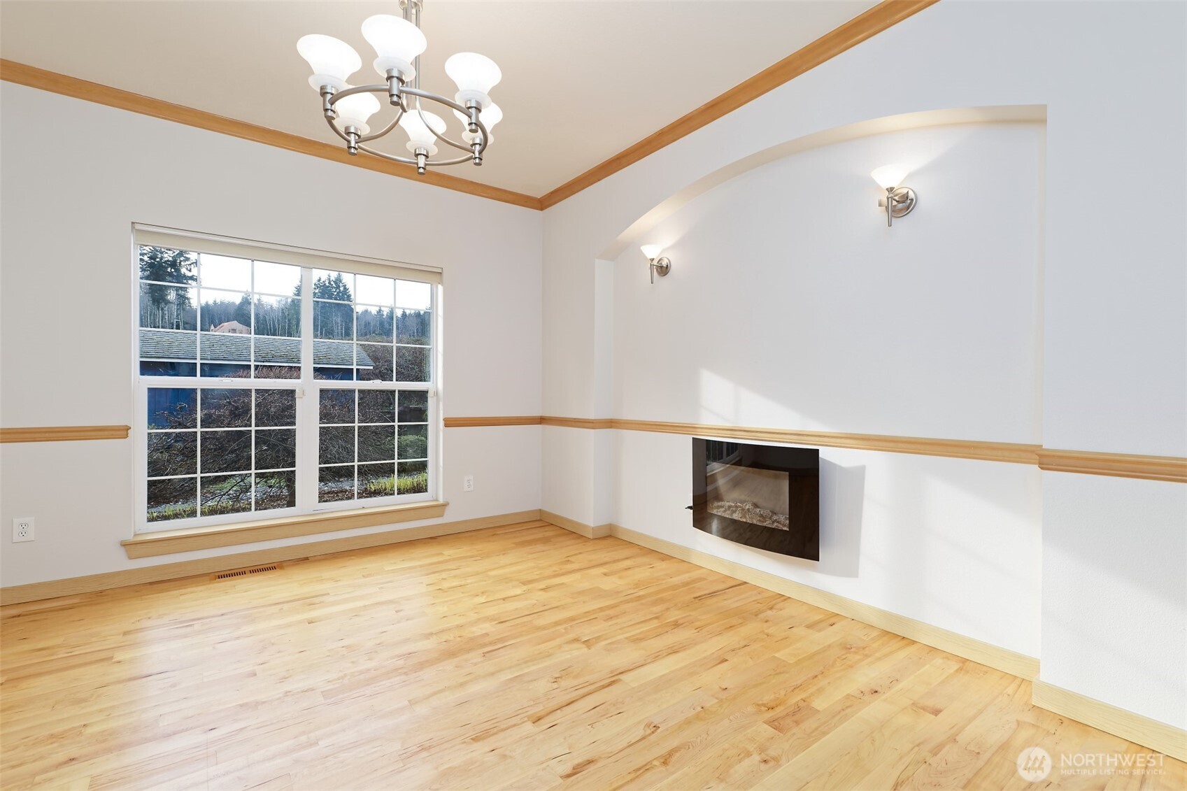 20 East Case View Place Shelton, WA 98584 - Photo 17 of 40 a view of an empty room with a window and wooden floor