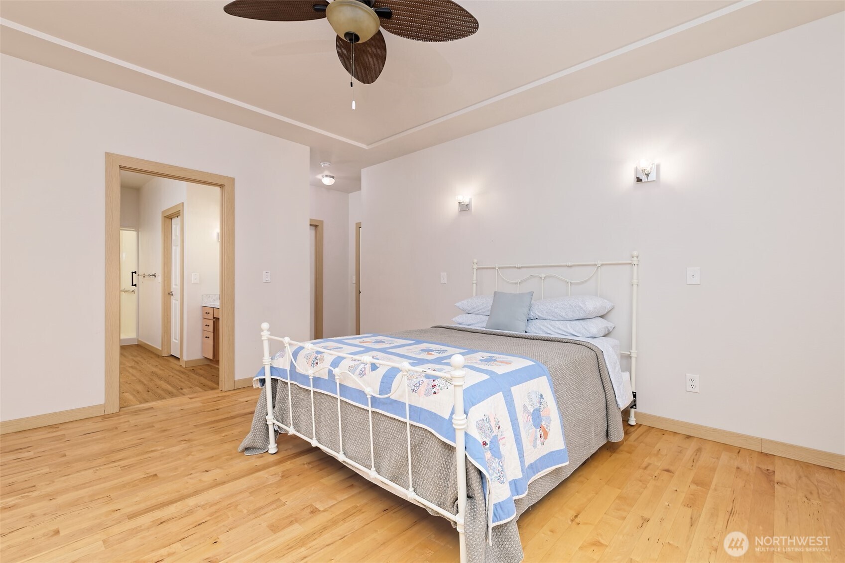 20 East Case View Place Shelton, WA 98584 - Photo 18 of 40 a bedroom with a bed and a chandelier