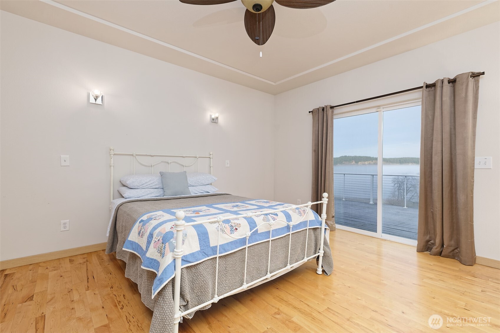 20 East Case View Place Shelton, WA 98584 - Photo 19 of 40 a bedroom with a bed and dresser with wooden floor