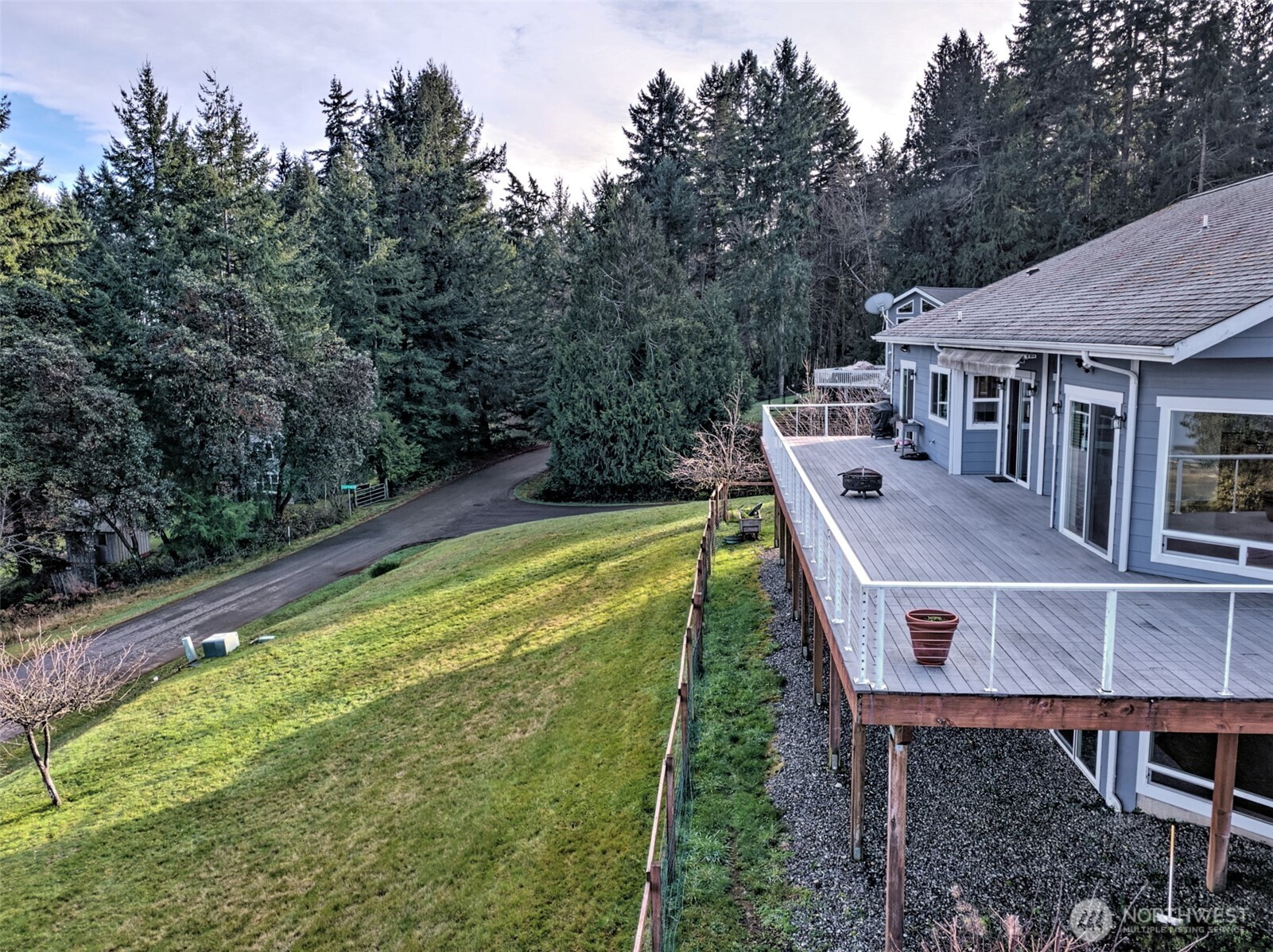 20 East Case View Place Shelton, WA 98584 - Photo 32 of 40 a view of a wooden deck and a backyard