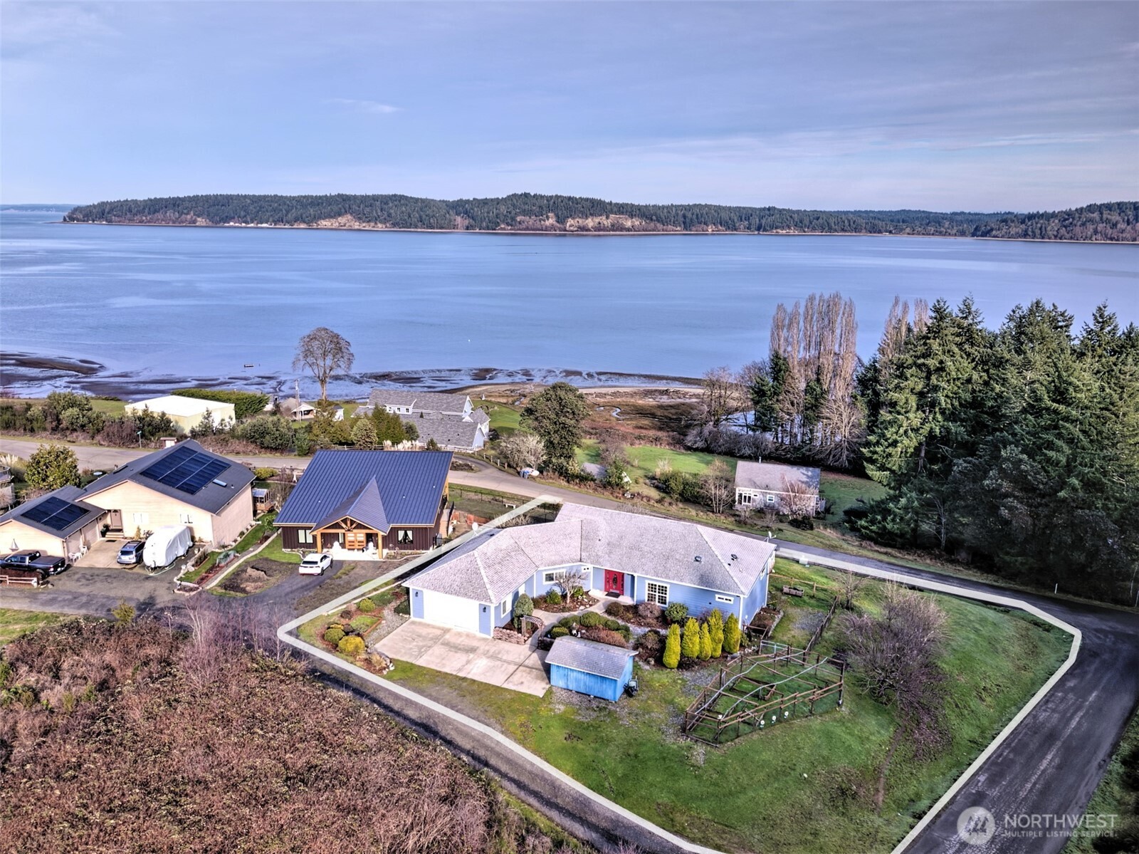 20 East Case View Place Shelton, WA 98584 - Photo 4 of 40 an aerial view of a house with a garden and lake view