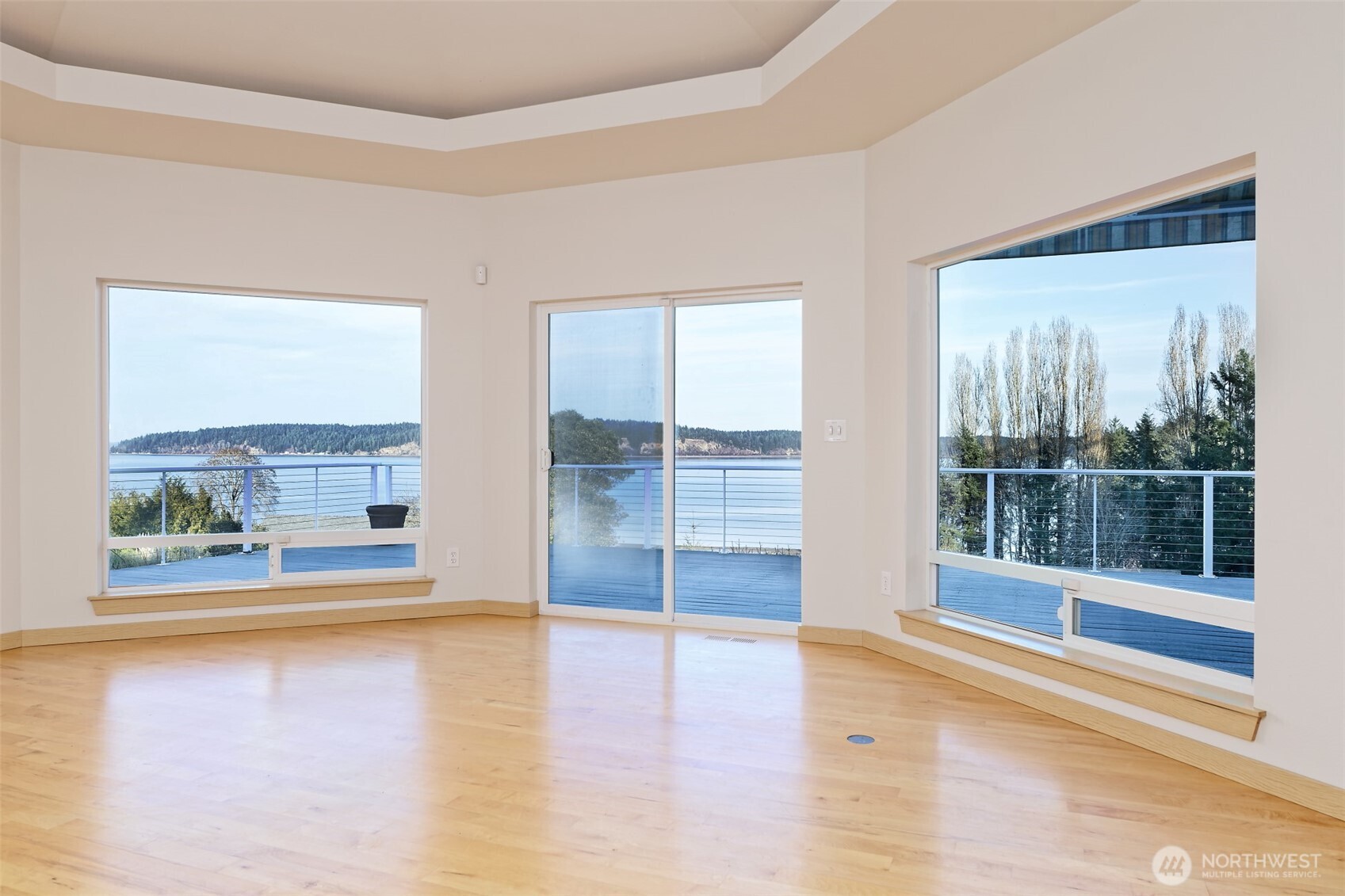 20 East Case View Place Shelton, WA 98584 - Photo 7 of 40 a view of an empty room with a large window and wooden floor