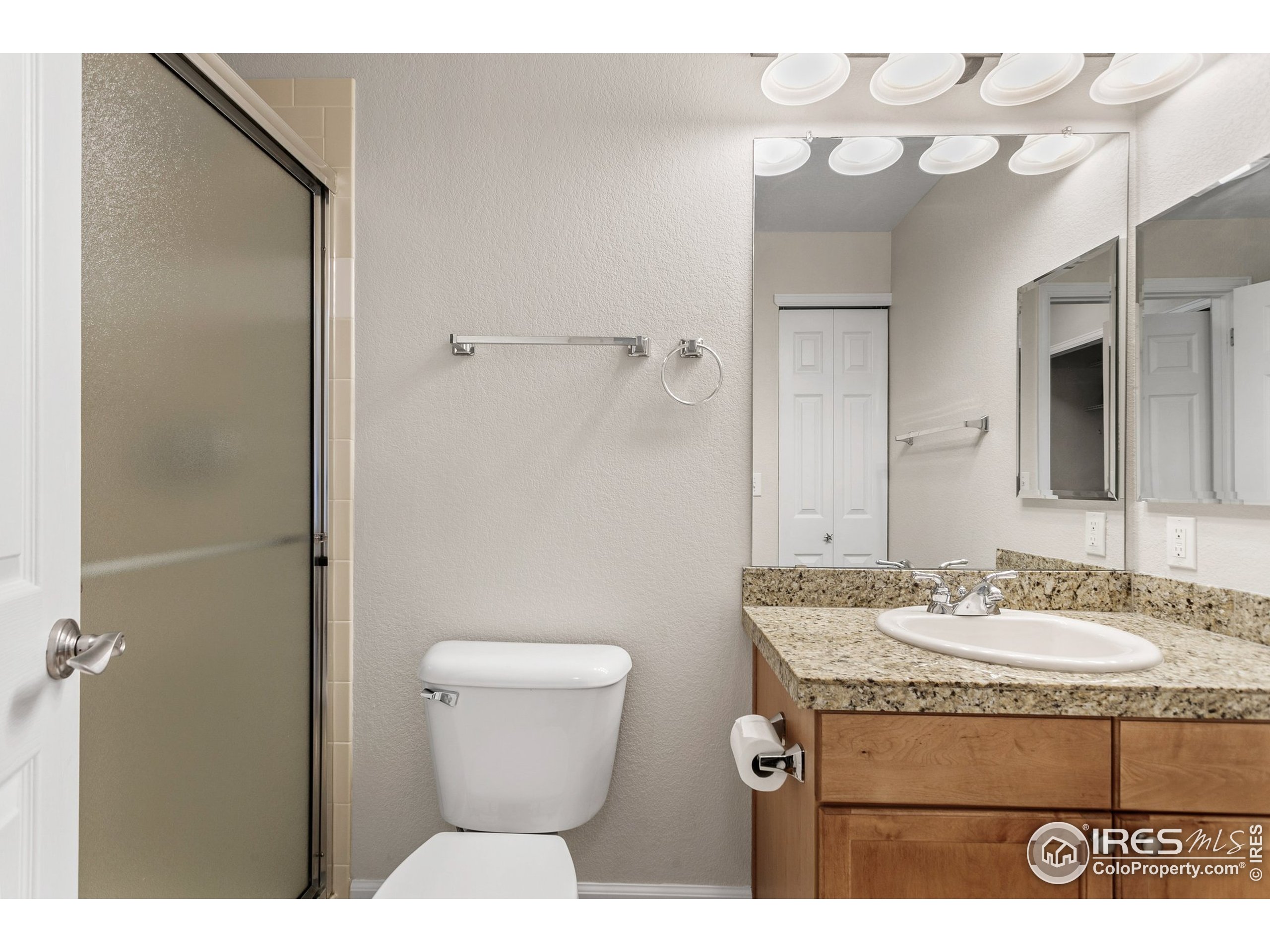 4500 Baseline Road, Unit 3302 Boulder, CO 80303 - Photo 17 of 22 a bathroom with a granite countertop sink toilet and shower