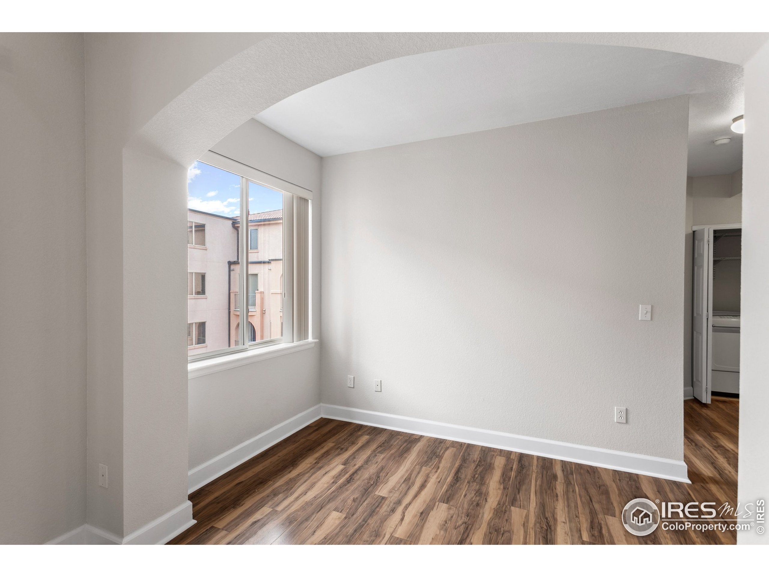 4500 Baseline Road, Unit 3302 Boulder, CO 80303 - Photo 19 of 22 a view of an empty room with wooden floor and a window