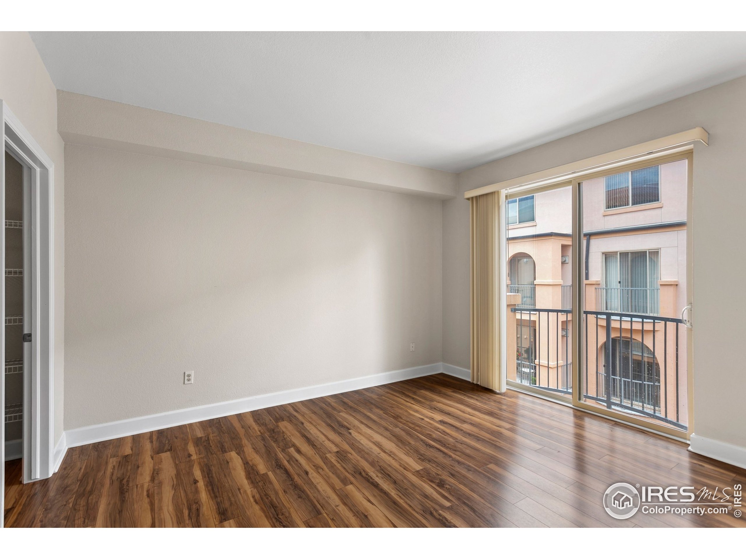 4500 Baseline Road, Unit 3302 Boulder, CO 80303 - Photo 20 of 22 a view of an empty room with wooden floor and a window