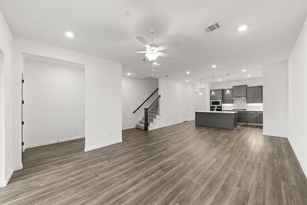 1237 Doris May Drive Allen, TX 75013 - Photo 6 of 19 Open-concept living area featuring wood-finish flooring, recessed lighting, and a ceiling fan