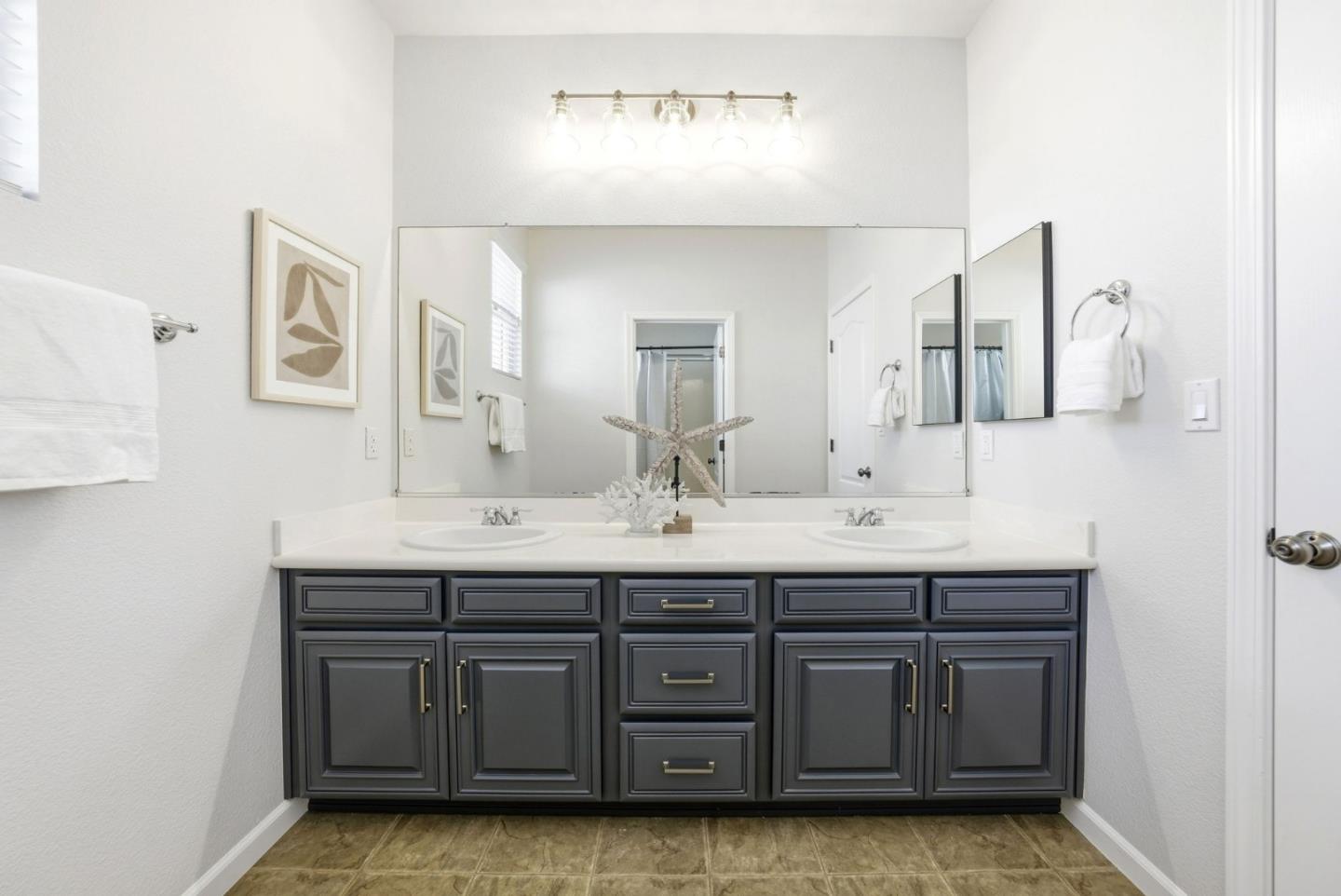 2556 Harlow Lane San Ramon, CA 94582 - Photo 44 of 62 a bathroom with a sink and a mirror