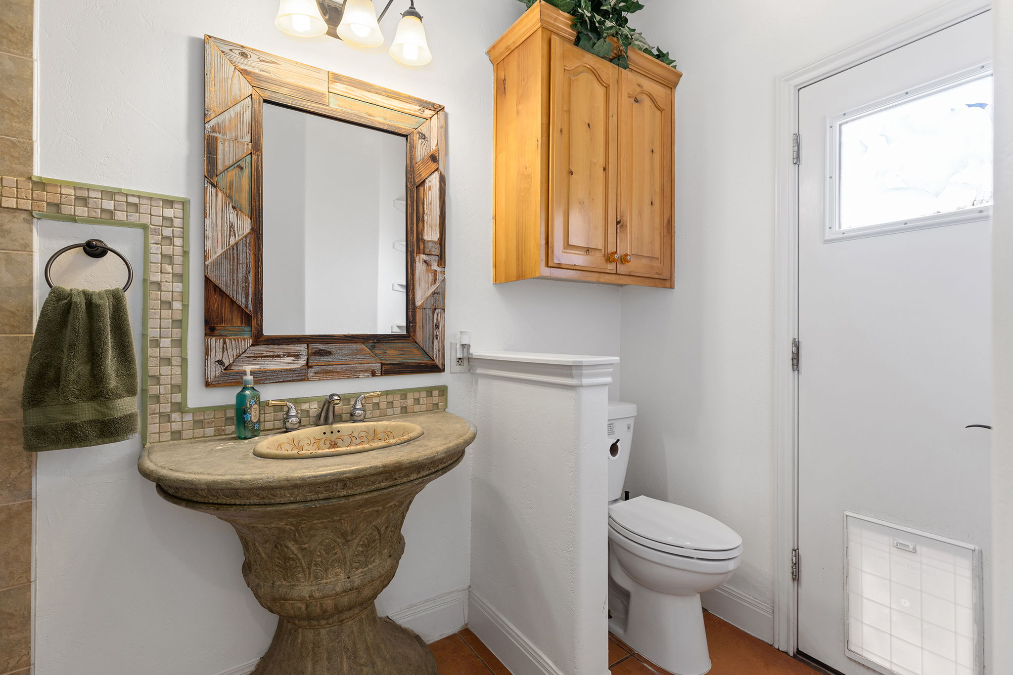 17308 St Therese Road Manor, TX 78653 - Photo 25 of 40 a bathroom with a sink toilet and mirror