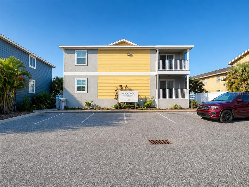 1013 Apollo Beach Boulevard, Unit 202 Apollo Beach, FL 33572 - Photo 1 of 18 a front view of a house with a yard and garage