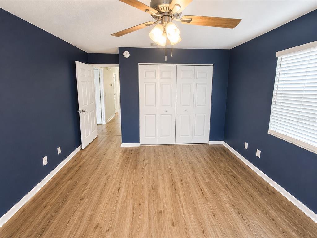 1013 Apollo Beach Boulevard, Unit 202 Apollo Beach, FL 33572 - Photo 13 of 18 wooden floor in an empty room with a window