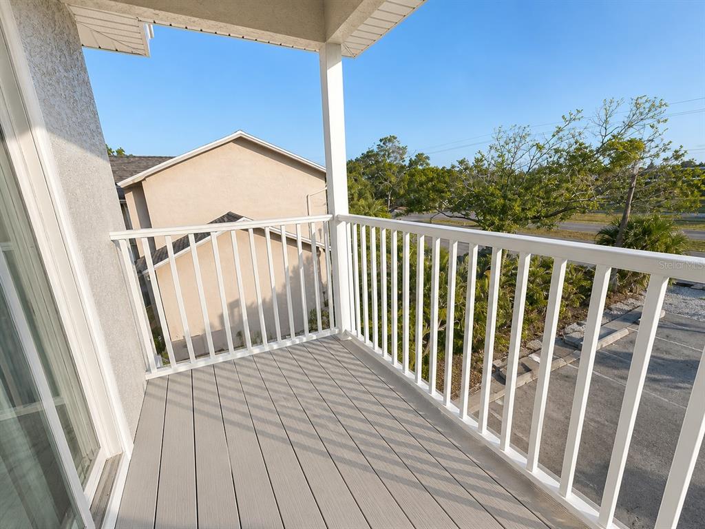 1013 Apollo Beach Boulevard, Unit 202 Apollo Beach, FL 33572 - Photo 16 of 18 a view of a balcony with wooden floor
