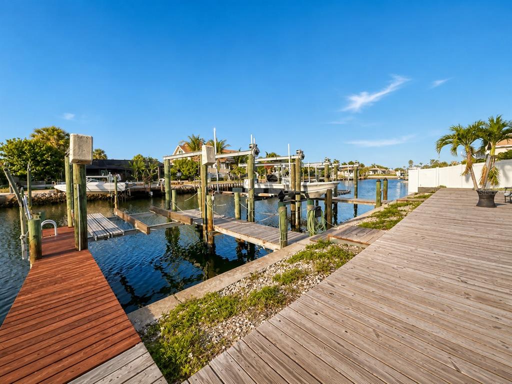 1013 Apollo Beach Boulevard, Unit 202 Apollo Beach, FL 33572 - Photo 18 of 18 a view of a roof deck with dining table and chairs