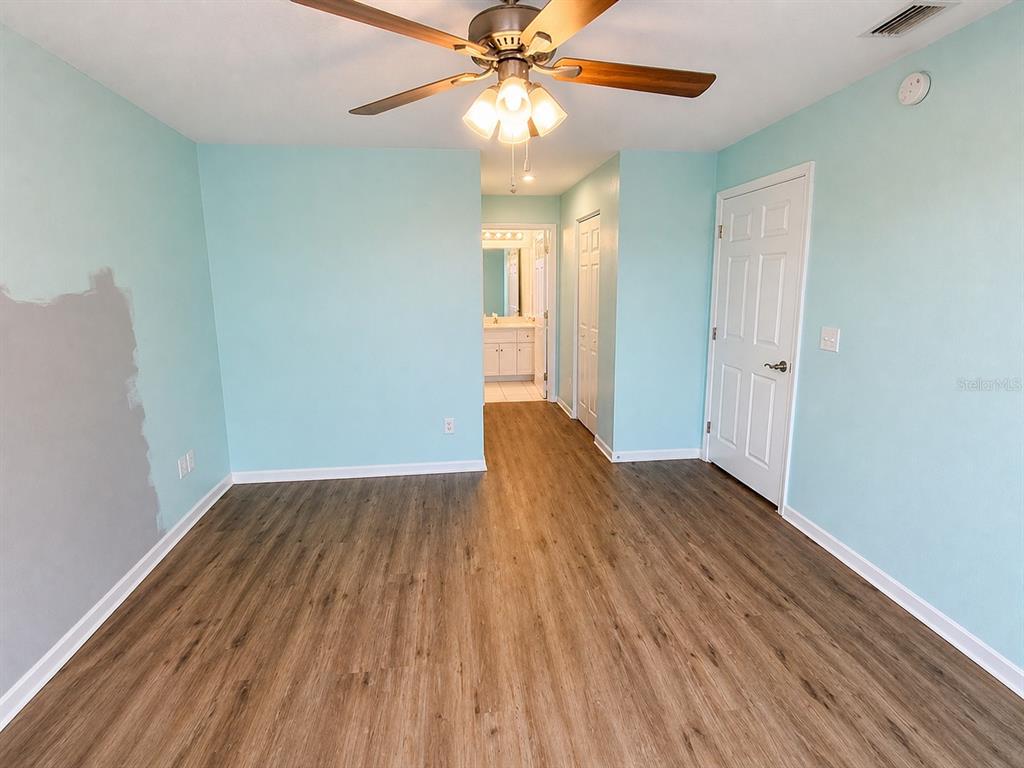 1013 Apollo Beach Boulevard, Unit 202 Apollo Beach, FL 33572 - Photo 7 of 18 wooden floor in an empty room with a window