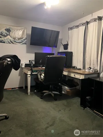 a room with furniture a rug and a window